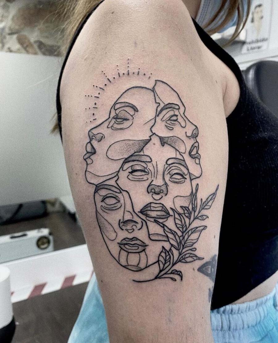 Many Faced Shoulder Tattoo
